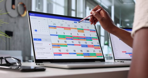 Busy African American Woman Managing Corporate Calendar On Laptop Online
