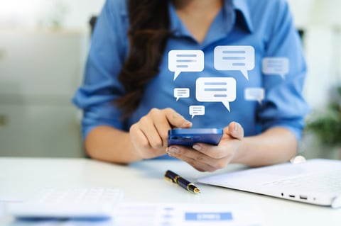 Woman hands User typing on smartphone and tablet chatting conversation in chat box icon pop up for social media marketing technology concept