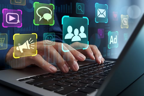 Marketer using laptop computer to analyze conversion rate