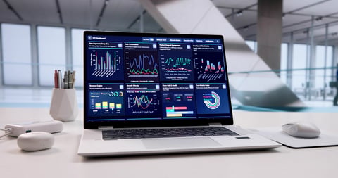 Analyzing Market Trends: Financial Analyst Working On Computer In Office