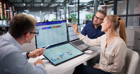 Sales Manager Leads Diverse Team Using CRM Dashboard